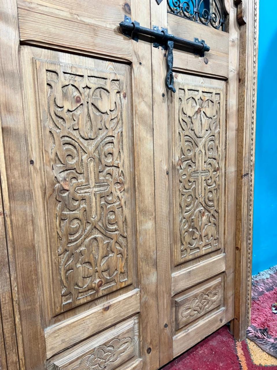 Traditional Moroccan door carved wooden door, with two windows in wrought iron worked a hand. wall decor.