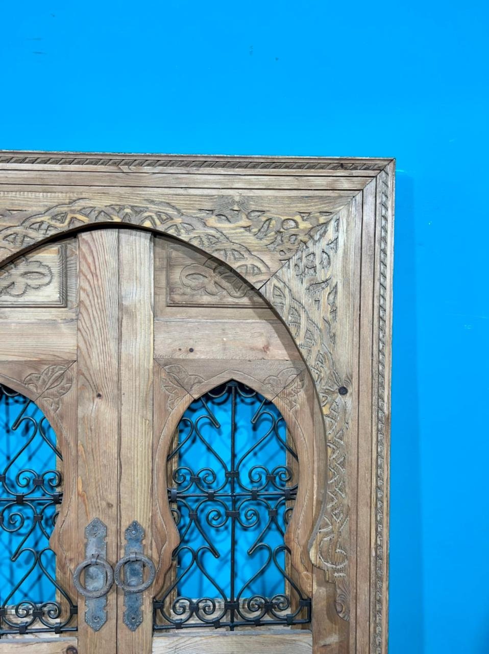 Traditional Moroccan door carved wooden door, with two windows in wrought iron worked a hand. wall decor.