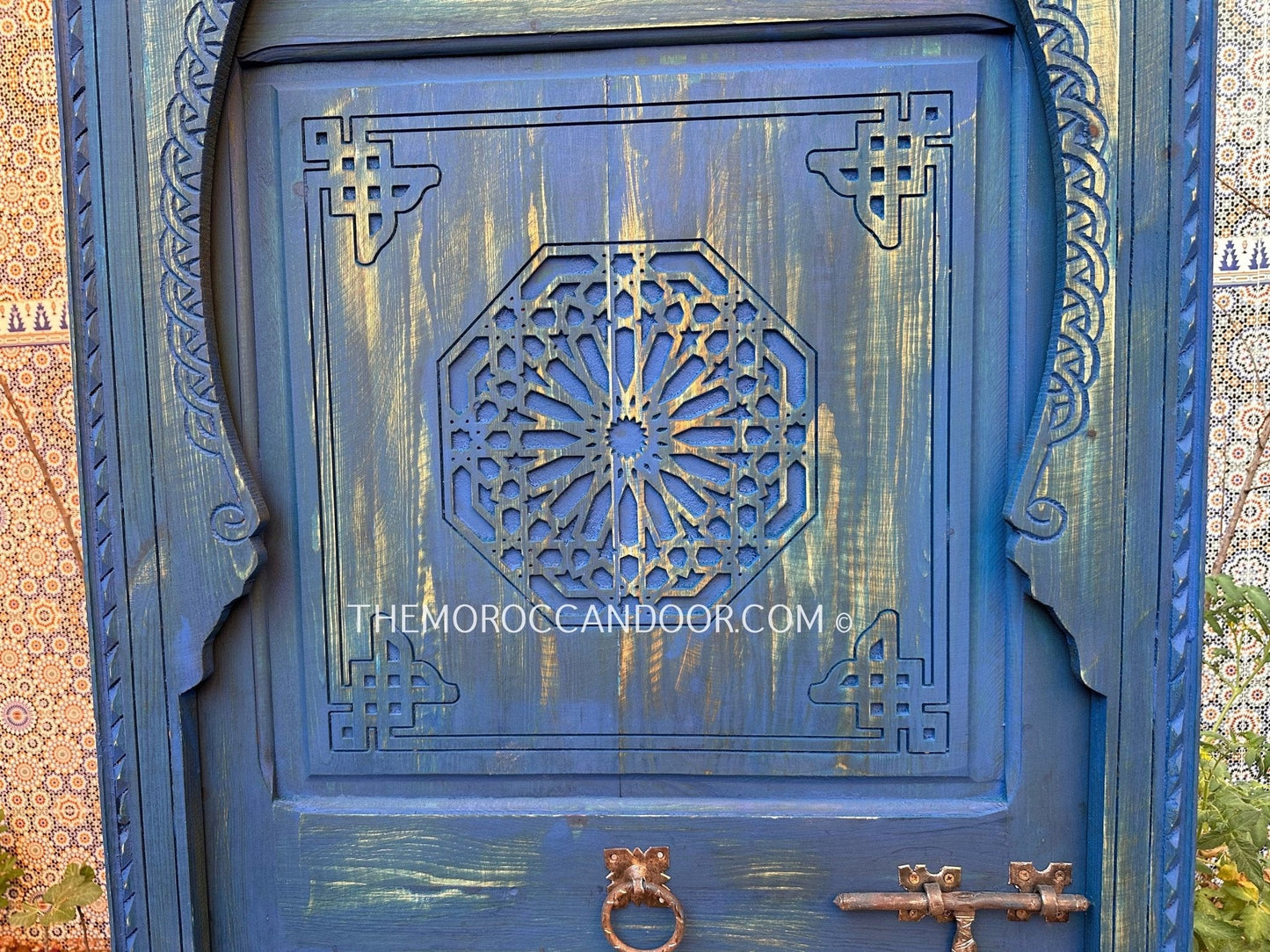 With This Custom Carved Moroccan Blue Door, you can bring the magic of Morocco into your home.