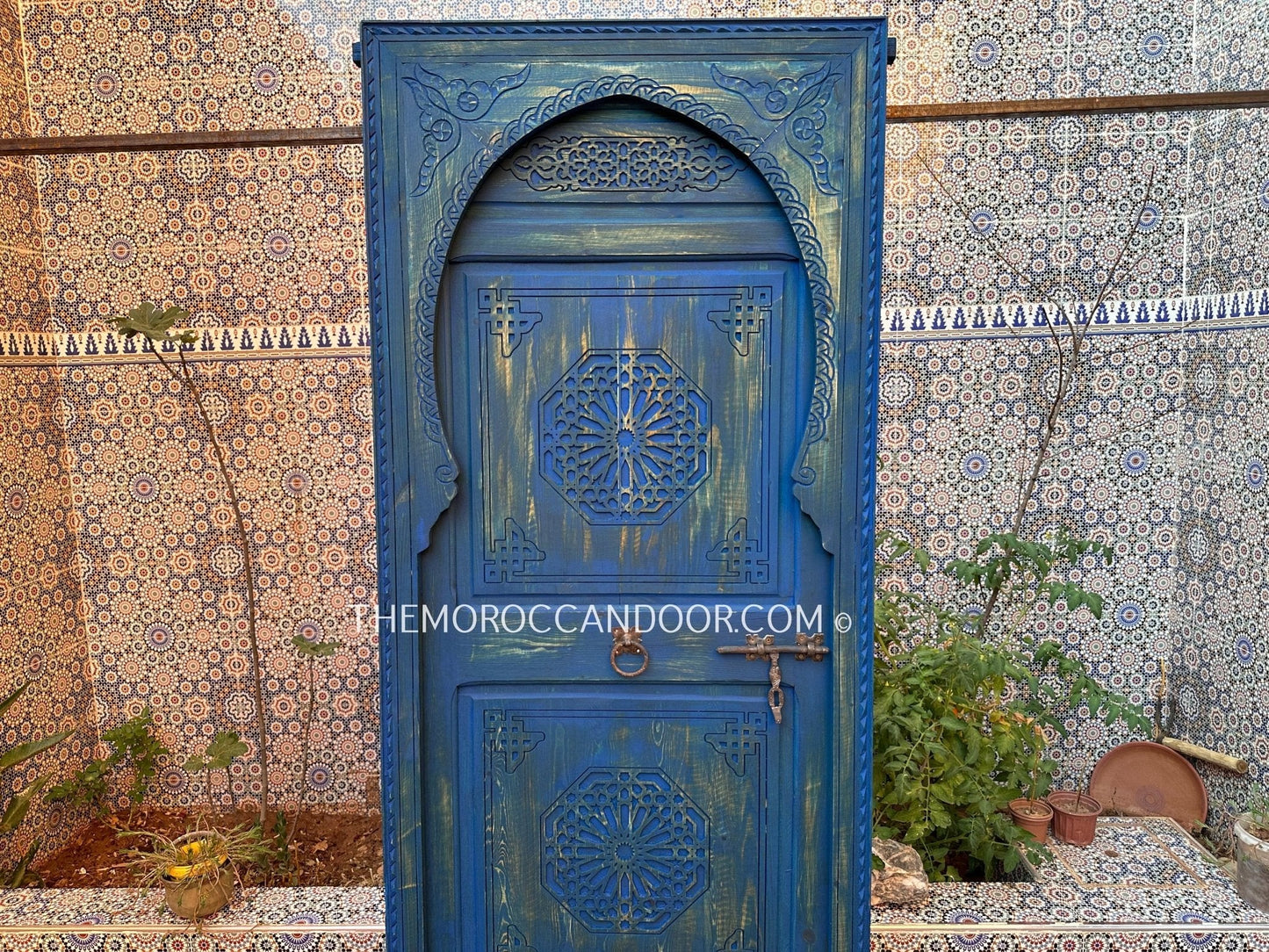 With This Custom Carved Moroccan Blue Door, you can bring the magic of Morocco into your home.