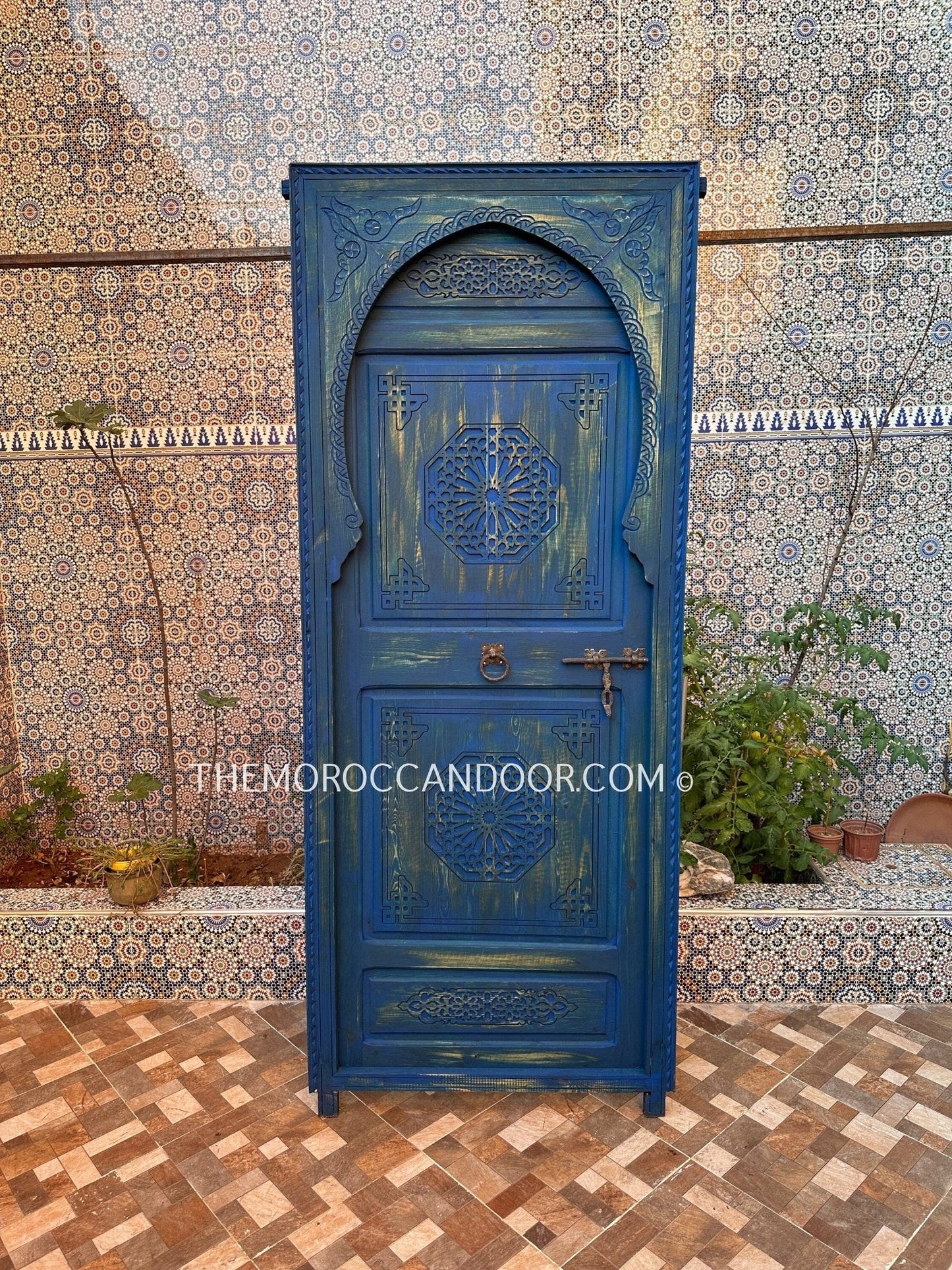 With This Custom Carved Moroccan Blue Door, you can bring the magic of Morocco into your home.