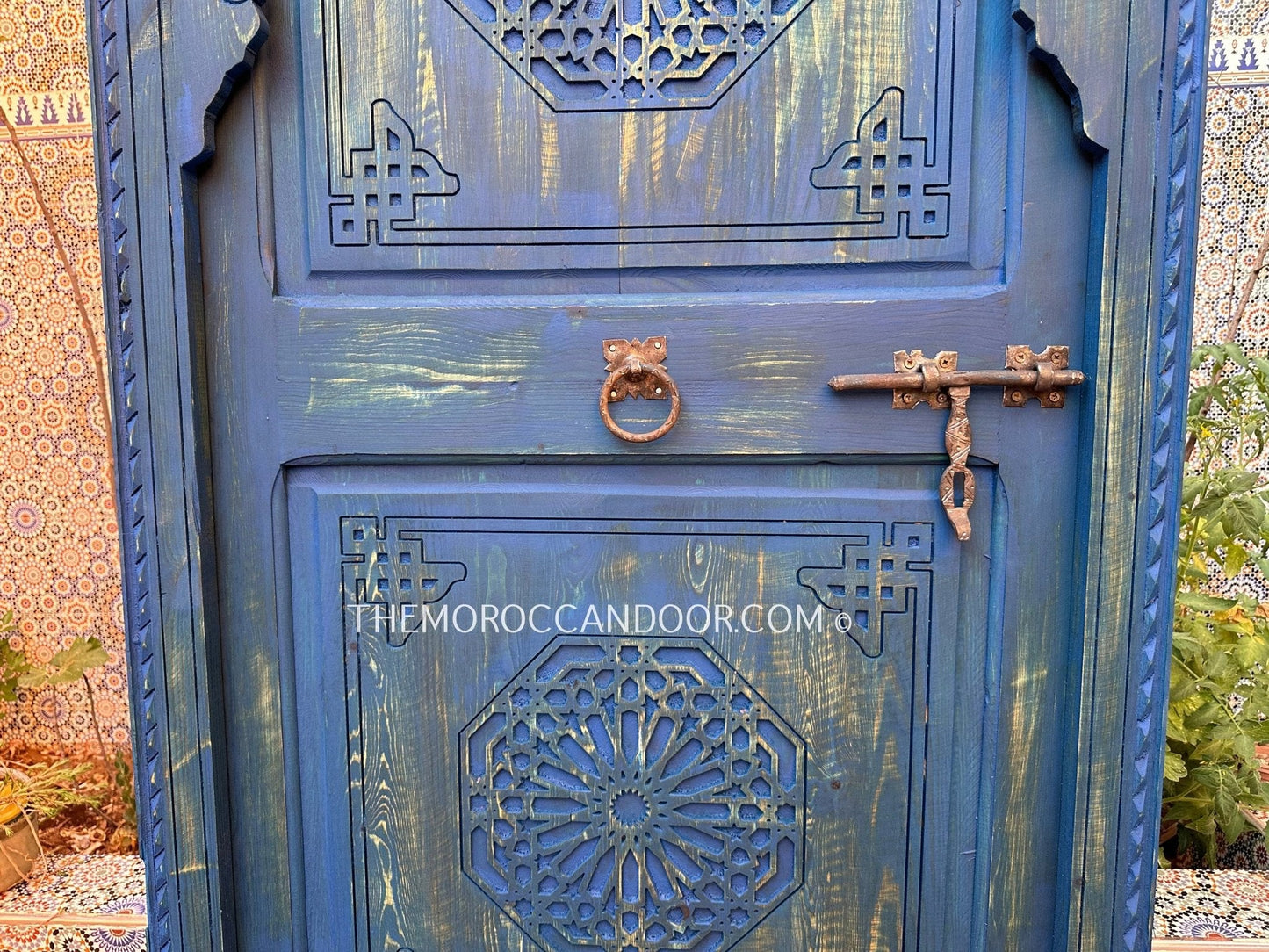 With This Custom Carved Moroccan Blue Door, you can bring the magic of Morocco into your home.