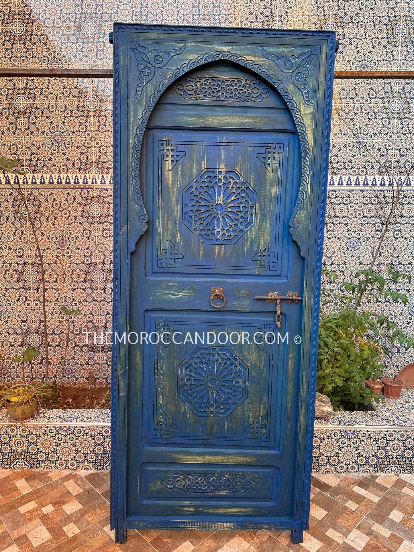 With This Custom Carved Moroccan Blue Door, you can bring the magic of Morocco into your home.