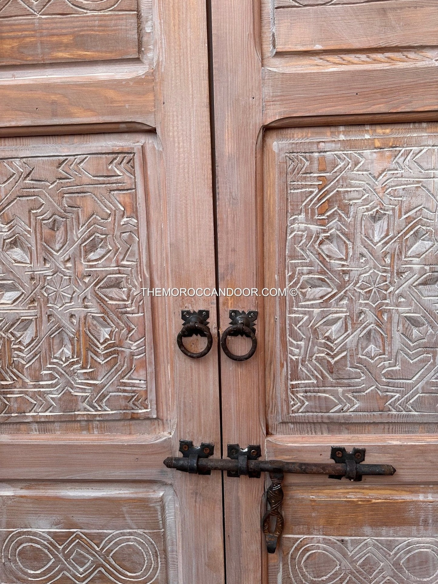 The tranquility and enchantment of Morocco enters your home through this exquisitely carved white door.