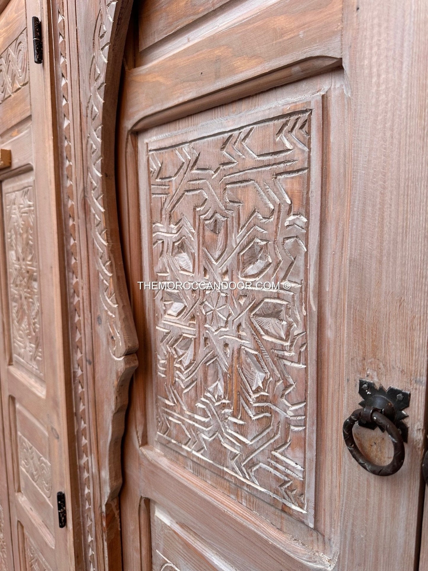 The tranquility and enchantment of Morocco enters your home through this exquisitely carved white door.